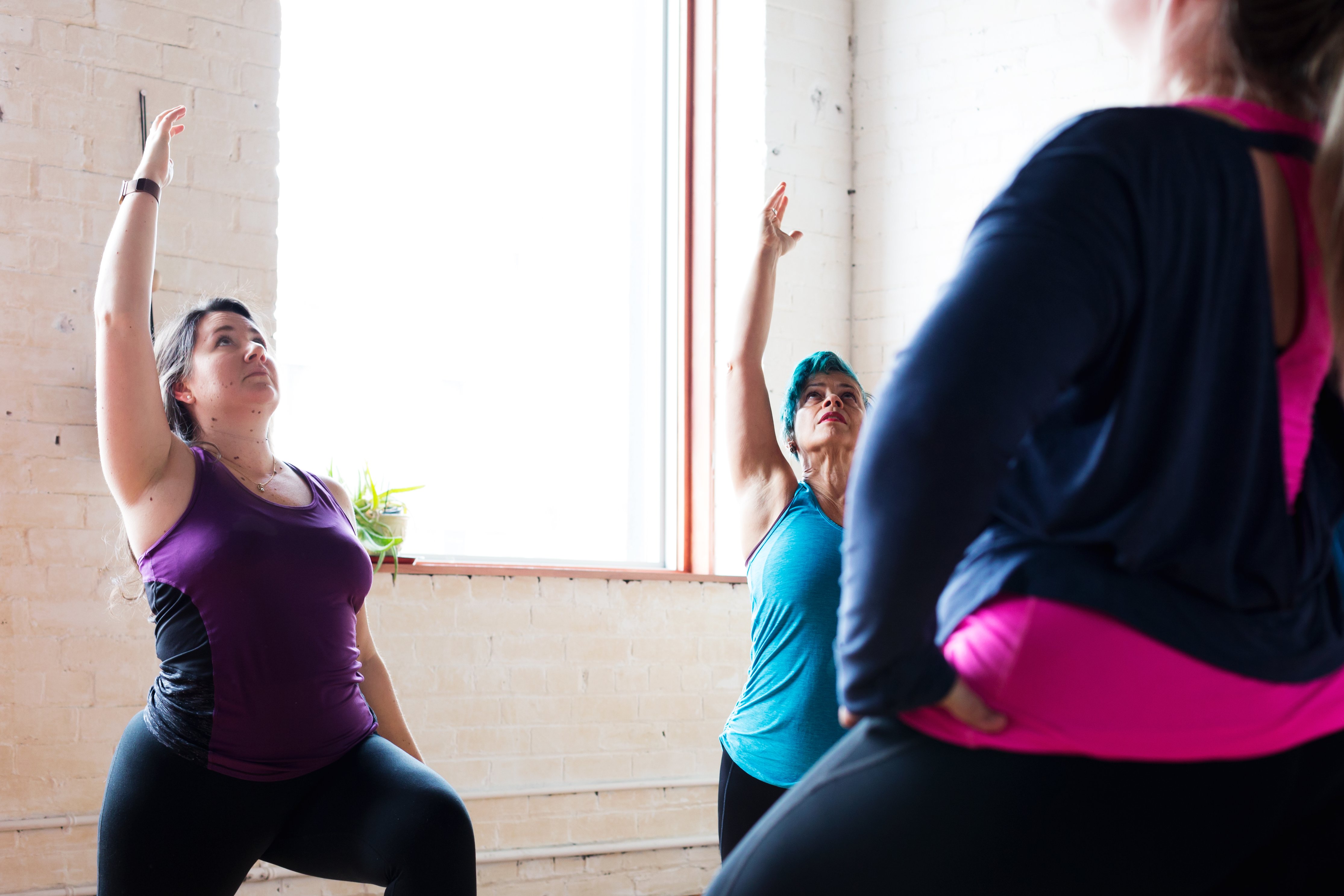 women practicing yoga